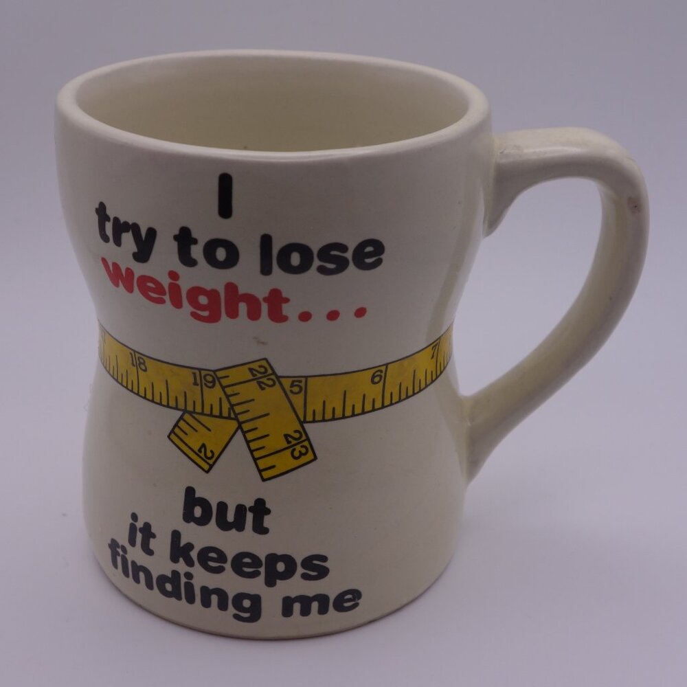 I try to lose weight... but it keeps finding me Ceramic Hourglass Coffee Mug